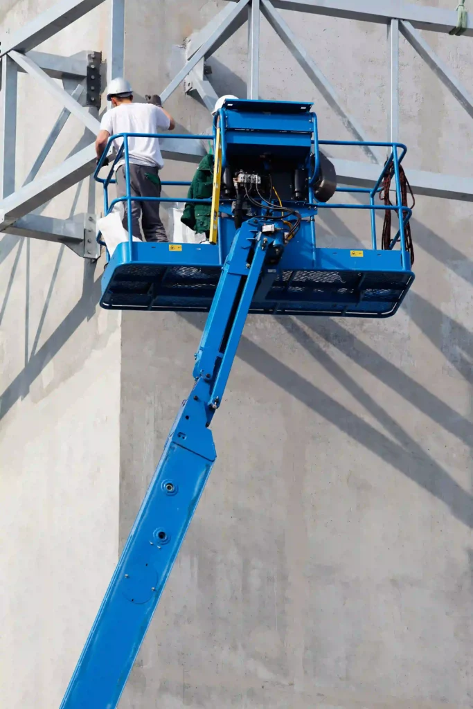 Worker Working On Lifted Boom Lift